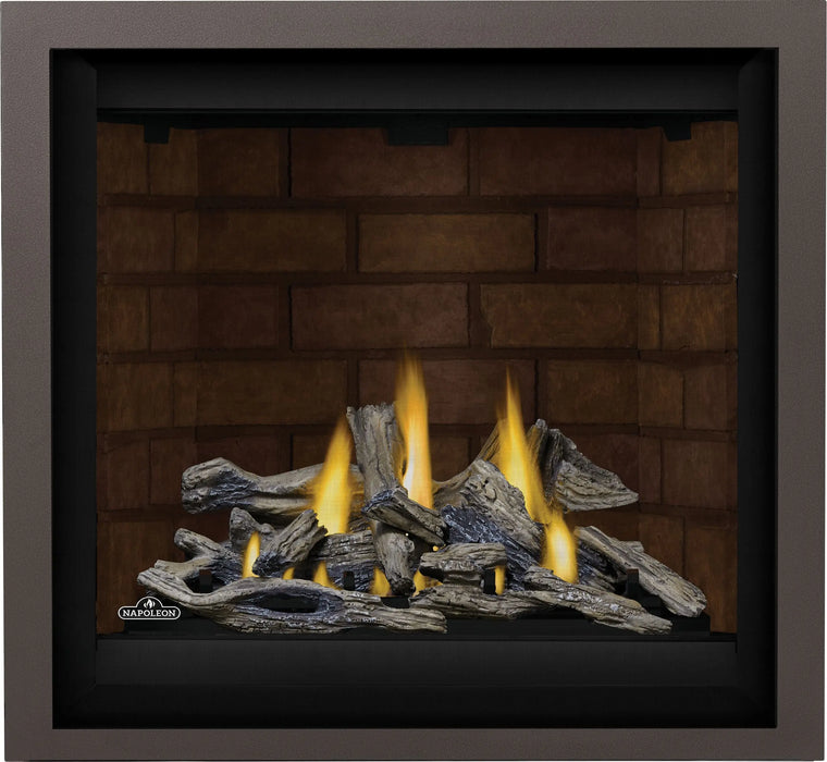 Napoleon Altitude X 36 gas fireplace, front view with driftwood logs, brick panels and copper finishing trim