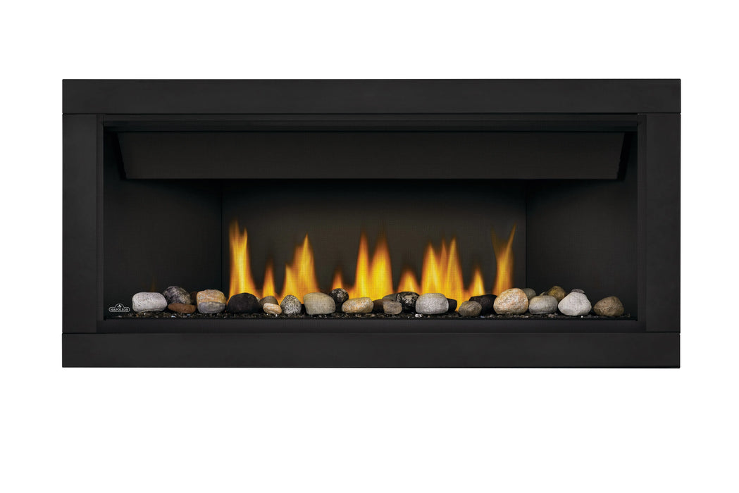 Napoleon Ascent Linear 46 gas fireplace, front view with mineral rocks, topaz glass embers, black surround