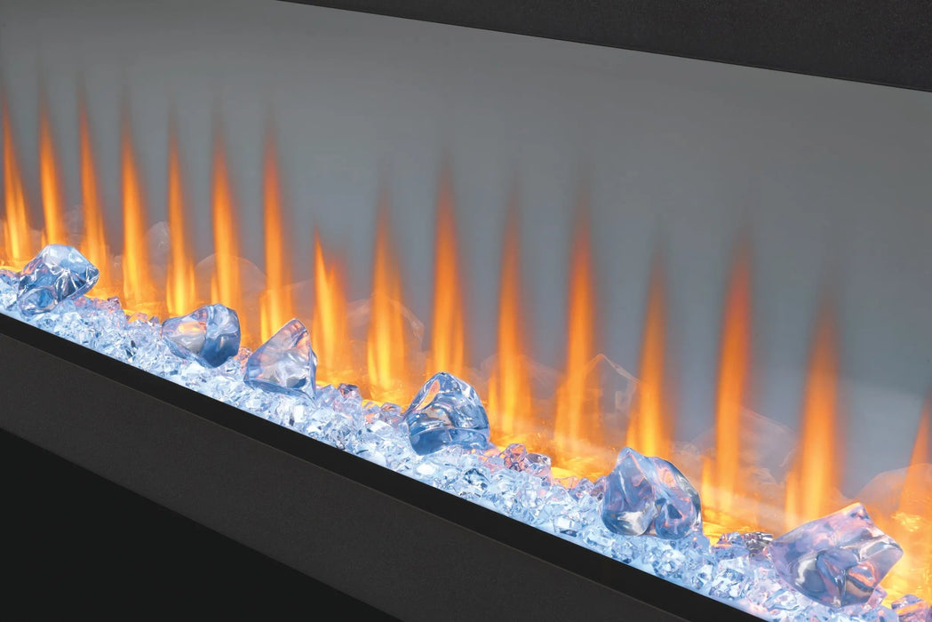 Napoleon CLEARion Elite 60 electric fireplace, angled close-up of orange flame and crystal embers, glass in semi-transparent mode