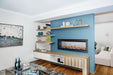 Napoleon CLEARion Elite 60 electric fireplace in a media room, glass in opaque mode
