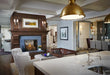 Napoleon High Definition 81 see-through gas fireplace in a living room with logs