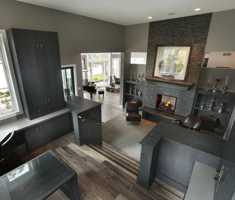 Napoleon High Definition 81 see-through gas fireplace in an office with logs