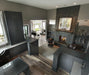 Napoleon High Definition 81 see-through gas fireplace in an office with logs