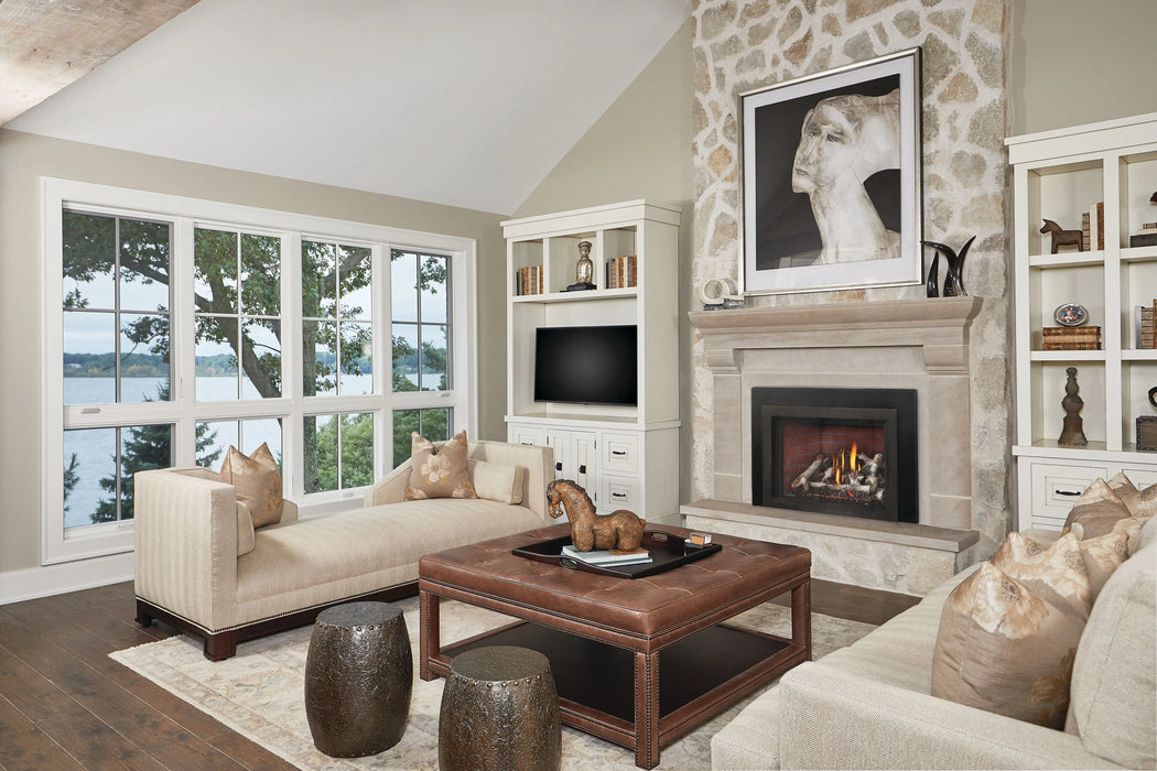 Napoleon Oakville X4 gas fireplace insert in a stone fireplace with birch logs