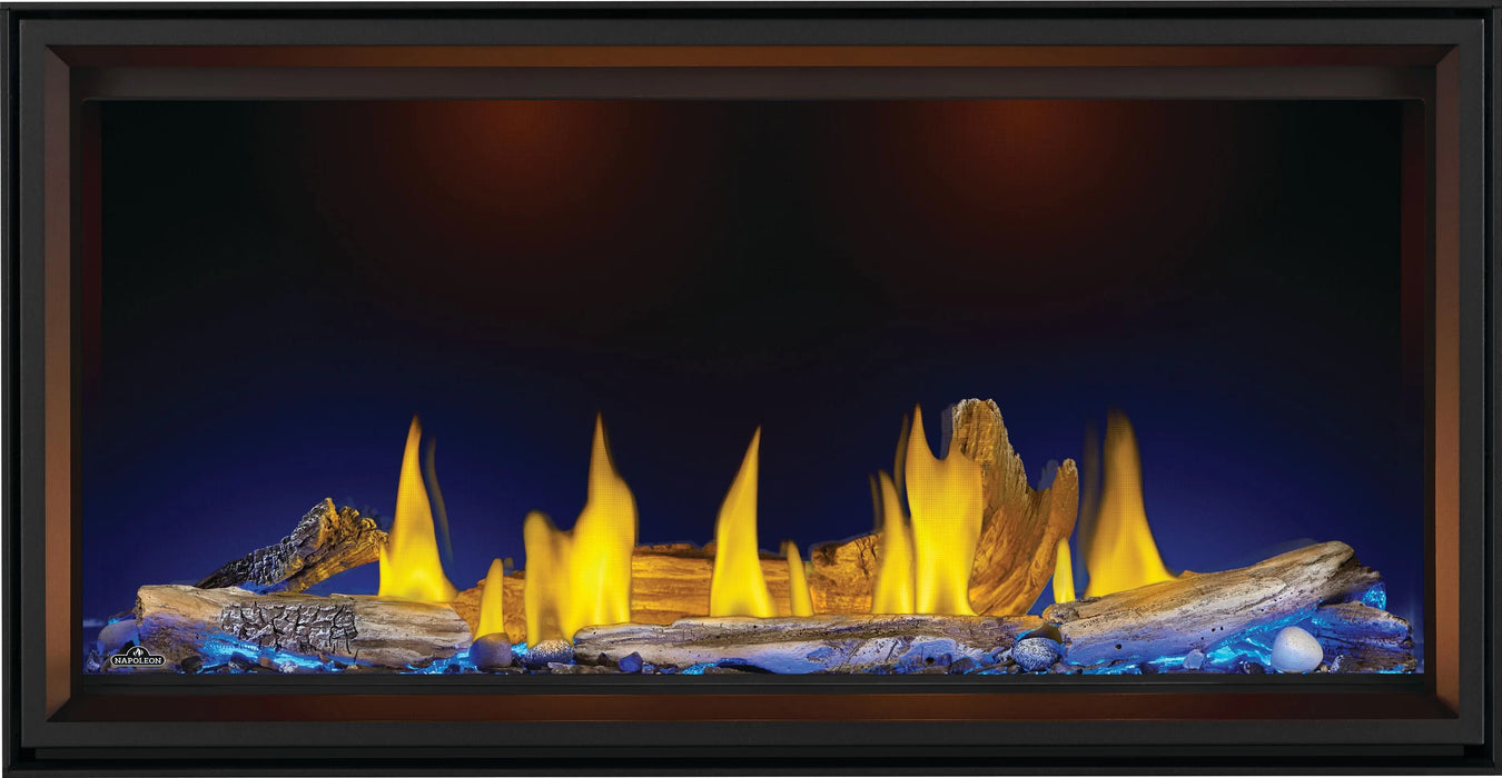 Napoleon Tall Vector 50 gas fireplace, front view with driftwood logs, blue ember lighting