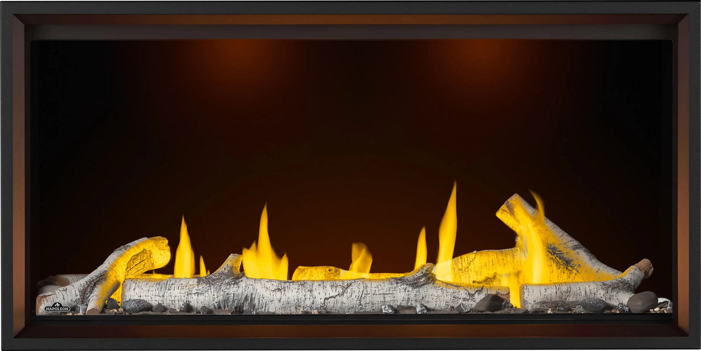 Napoleon Tall Vector 50 gas fireplace, front view with birch logs, night light on