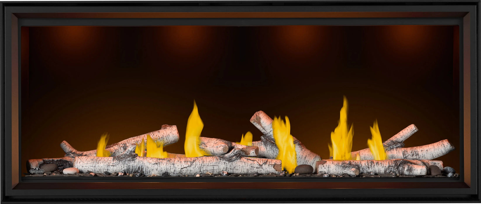 Napoleon Tall Vector 62 gas fireplace, front view with birch logs, top lights on