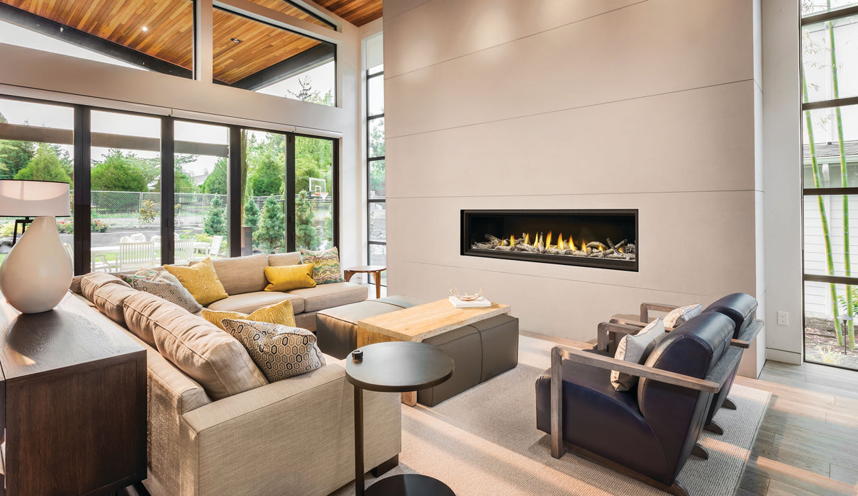 Napoleon Vector 74" Direct Vent Gas Fireplace - installed in a living room wall beside large windows