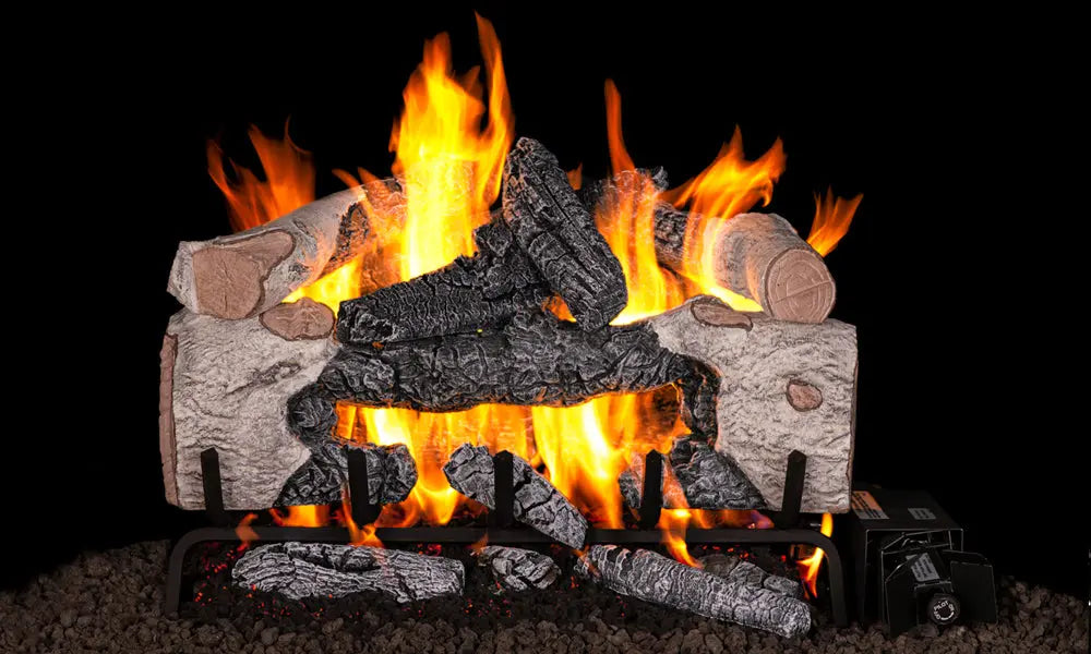 Charred Cinder Birch gas logs with white birch bark burning on a black background