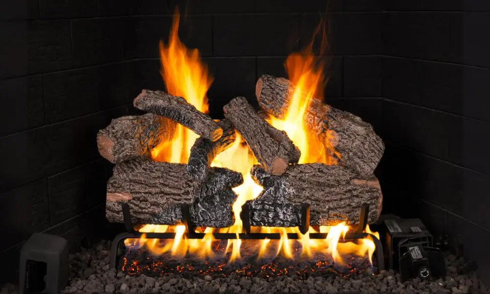 Charred Oak Flame Enhanced gas logs burning on a black background