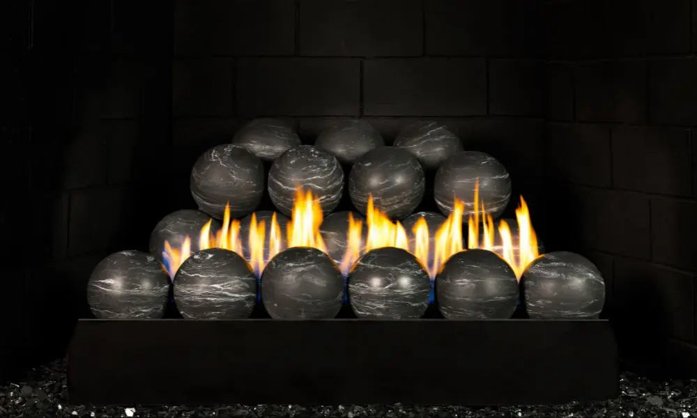 Nero Marquina black spheres with white veining stacked on a G23 burner with flames