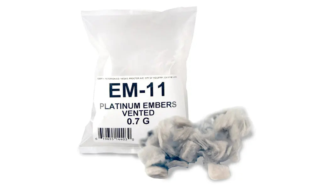 bag labeled EM-11 with loose white Bryte Coals