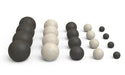 black and gray spheres lined up in five sizes from large to small