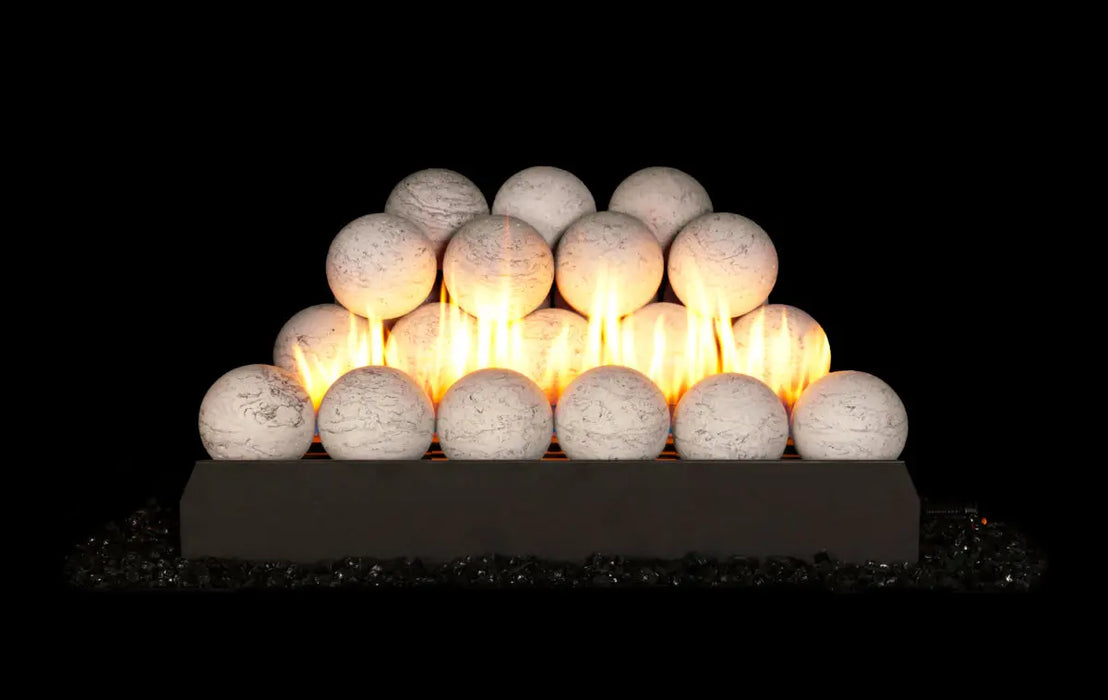 white marble spheres stacked on a G23 burner with flames