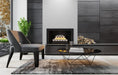 modern living room with a dark fireplace wall and spheres burning in the fireplace