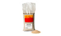 bag of white sand with a small pile beside it