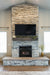 Empire Vail 32 vent-free fireplace in a grey brick wall room setting