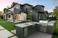 Wildfire Ranch Pro 36" gas grill with brushed bronze Designer Finish hardware built into an L-shaped outdoor kitchen island