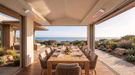 Bromic Tungsten Smart-Heat Electric Coastal heaters over an oceanfront dining table