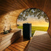 HUUM CORE Black electric sauna heater installed in a barrel sauna
