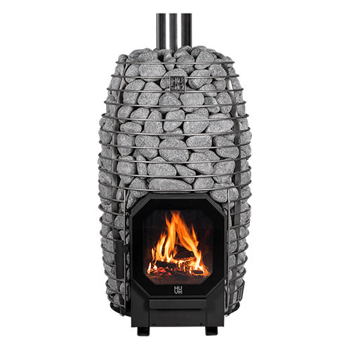 HUUM HIVE Flow wood-burning sauna stove filled with stones with a fire burning, front view