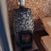 HUUM HIVE Flow wood-burning sauna stove installed in a sauna room