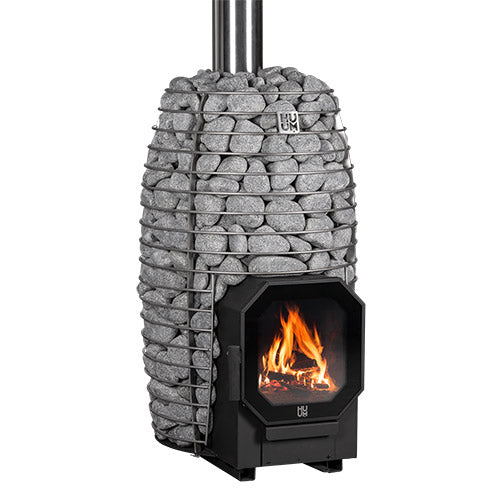 HUUM HIVE Flow wood-burning sauna stove filled with stones, angled view