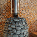Top of the HUUM HIVE Flow sauna stove with stones and chimney connection