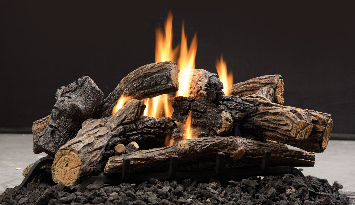 Kingsman GLVF vent-free burner lit beneath a split oak fiber log set, side view