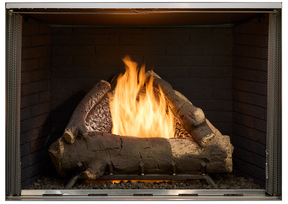Majestic Black Premium Traditional Interior Panels for Courtyard 36" & 42" Gas Fireplace (ODCOUG-36BKTR / 42BKTR) installed in a Courtyard fireplace with oak logs burning