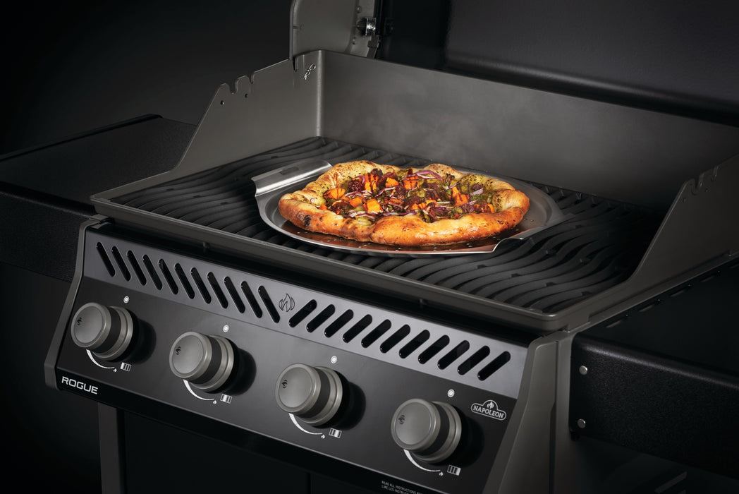 56066 14"(35.5cm) Stainless Steel Pizza Pan – in use, with pizza