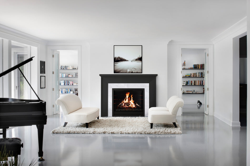 SimpliFire Black Folio front on an Inception 36" with black brick liner and birch logs in a living room