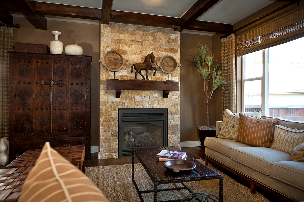 Empire Vail 36 vent-free fireplace with Ravenwood Select logs and banded brick liner in a living room