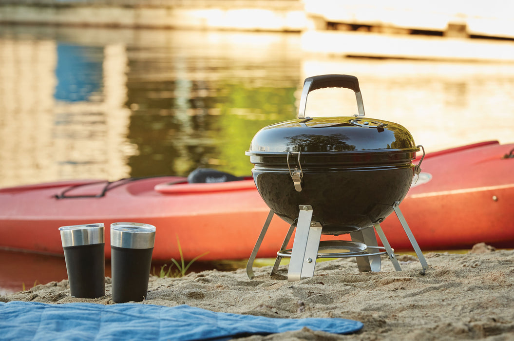 Napoleon 14" Portable Charcoal Kettle Grill - on a beach beside a kayak