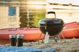 Napoleon 14" Portable Charcoal Kettle Grill - on a beach beside a kayak