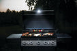 Napoleon 70049 Grill Light - light illuminating a grill at night