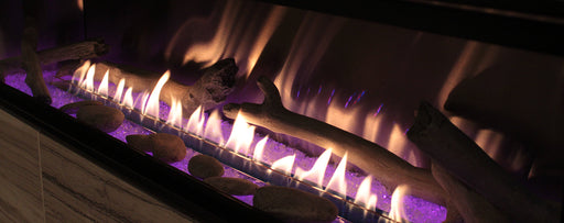 Empire Log Set for Boulevard Fireplace, close-up of logs with purple LED lighting